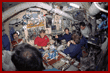 Crewmembers share a meal in the Mir Space Station Base Block  